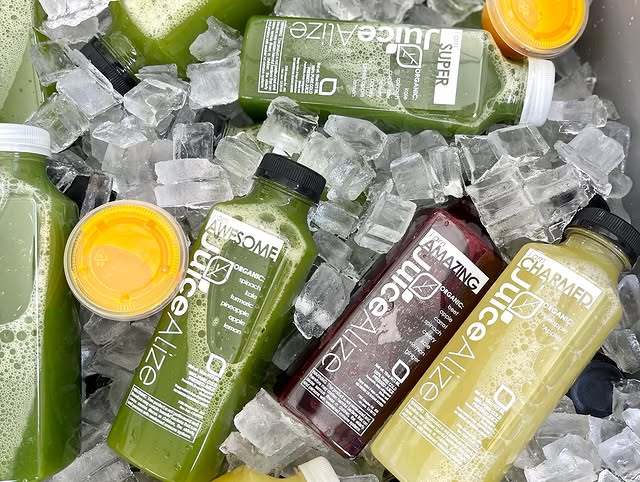 Rows of JuiceAlize bottles merchandised in a grab-and-go cooler