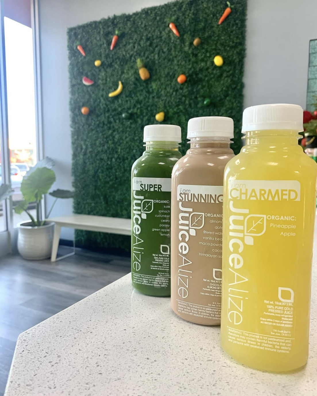 JuiceAlize cold-pressed juice bottles — I Am Super, I Am Stunning, and I Am Charmed